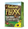Image of the game box for Nature Fluxx with a brown signpost, brick wall, butterfly, lady bug, and yellow flower