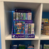 Photo of the POP Display filled with games and placed inside a square bookshelf