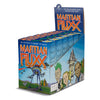 Display box with six games for Martian Fluxx with a blue box and orange logo and an image of a three legged tripod picking up a cow