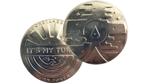 Photo of the Pyramid Arcade Coin showing It's My Turn etched into one side