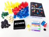 Box and contents image for Zendo showing colorful translucent pyramids, blocks and wedges + stones, cards, and rules