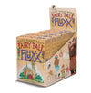 Display box with six games for Fairy Tale Fluxx showing a peach colored box with an image of a castle and a giant on the side
